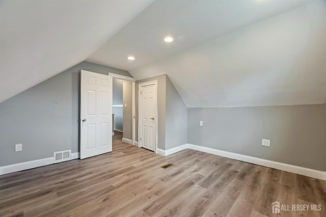 48 Columbus Ave, Edison, NJ 07008 - additional living space featuring vaulted ceiling, baseboards, wood finished floors, and recessed lighting