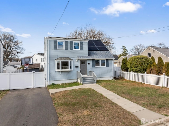 48 Columbus Ave, Edison, NJ 07008 - view of front of home featuring a gate, solar panels, and roof with shingles