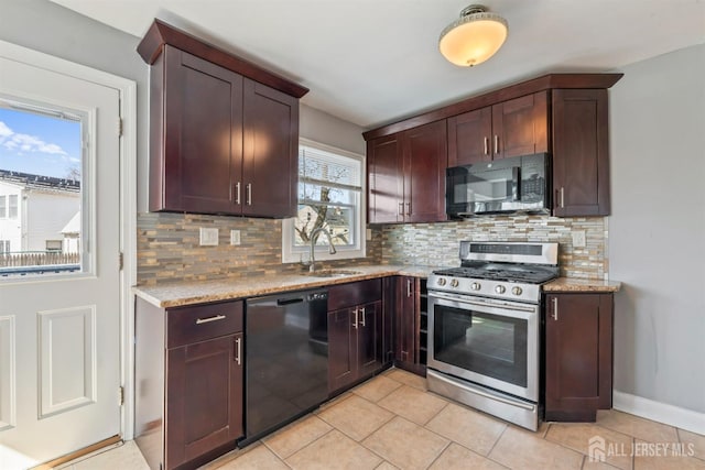 48 Columbus Ave, Edison, NJ 07008 - kitchen featuring gas range, black dishwasher, a sink, backsplash, and light tile patterned flooring