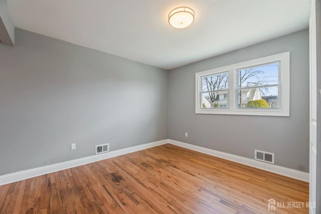 48 Columbus Ave, Edison, NJ 07008 - unfurnished room with baseboards and wood finished floors