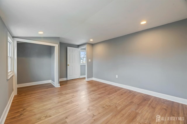 48 Columbus Ave, Edison, NJ 07008 - unfurnished bedroom with baseboards, a closet, light wood-style floors, and recessed lighting