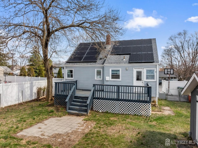 48 Columbus Ave, Edison, NJ 07008 - back of house with a shingled roof, a chimney, solar panels, and a deck