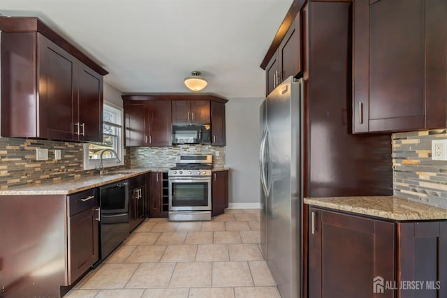 48 Columbus Ave, Edison, NJ 07008 - kitchen featuring black appliances, a sink, decorative backsplash, and light stone countertops