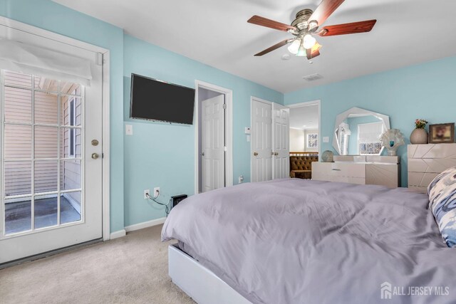 bedroom featuring ceiling fan and light colored carpet