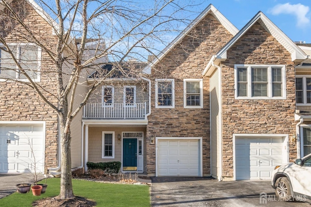 view of front of house with a garage and a balcony