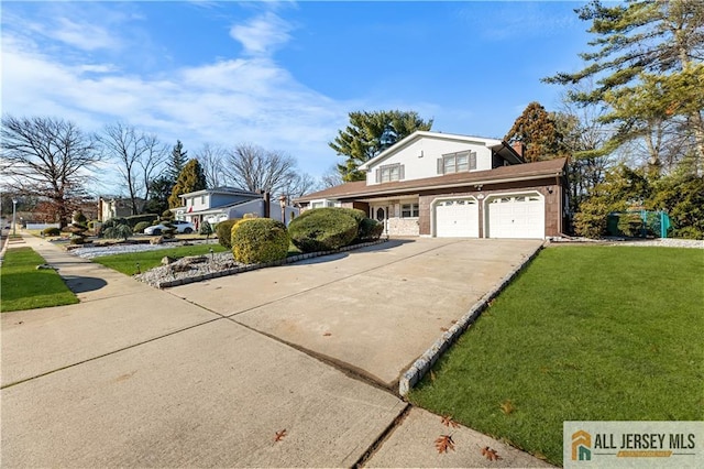 view of side of property featuring a yard and a garage