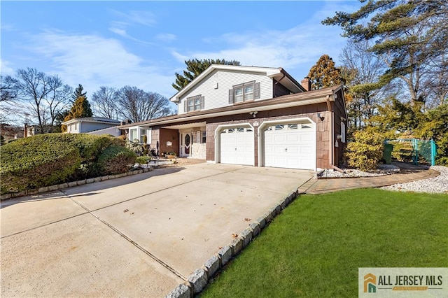 front of property with a garage and a front lawn