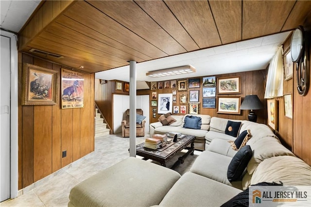 living room featuring wood walls and wood ceiling