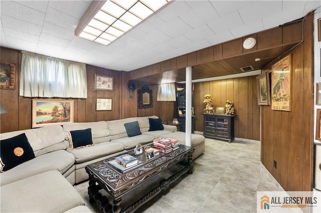 living room featuring wooden walls