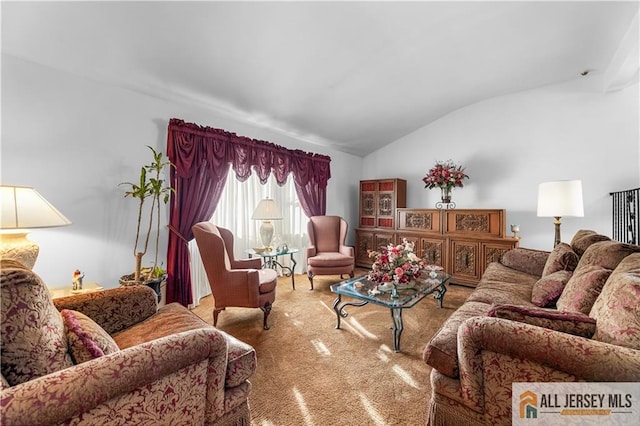 living room featuring carpet flooring and vaulted ceiling