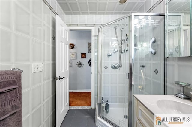 bathroom featuring vanity, tile patterned floors, and an enclosed shower