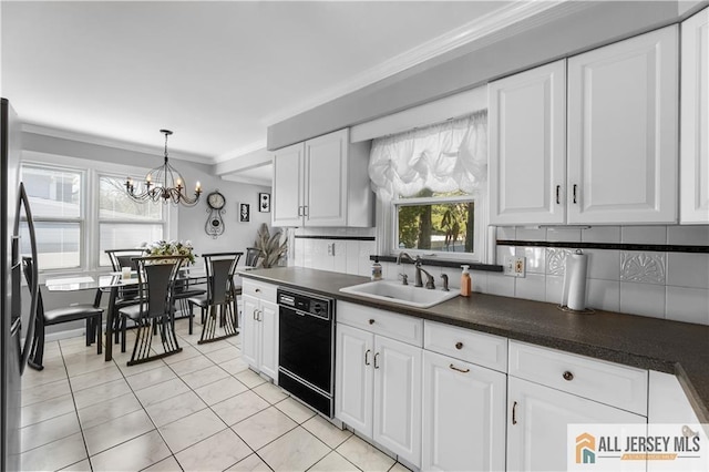 kitchen with dishwasher, sink, decorative backsplash, stainless steel fridge, and white cabinetry