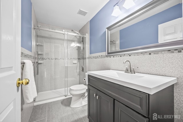 1004 Antoinette Dr, Monroe, NJ 08831 - full bath with tile walls, a stall shower, vanity, a wainscoted wall, and tile patterned floors