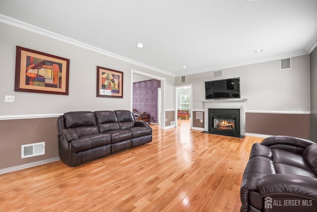 1004 Antoinette Dr, Monroe, NJ 08831 - living room with light wood-style flooring, ornamental molding, recessed lighting, and a fireplace with flush hearth