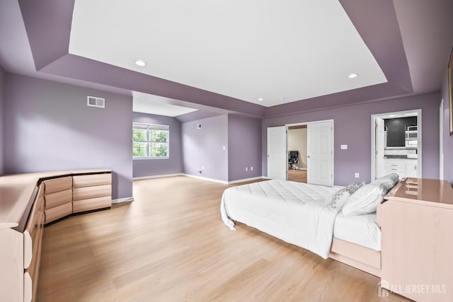 1004 Antoinette Dr, Monroe, NJ 08831 - bedroom with a raised ceiling, light wood-style floors, and recessed lighting