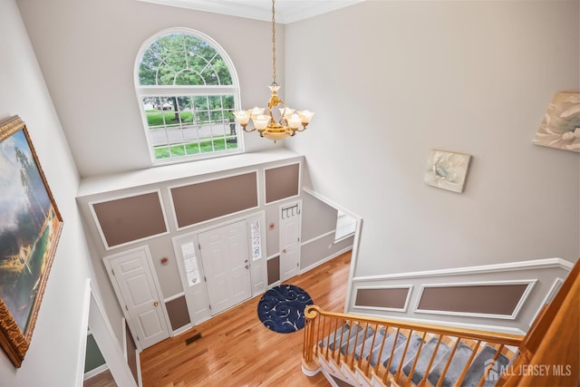 1004 Antoinette Dr, Monroe, NJ 08831 - foyer with a chandelier, wood finished floors, and crown molding
