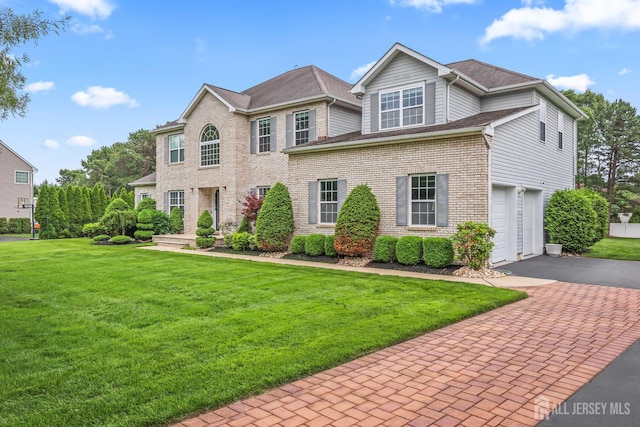 1004 Antoinette Dr, Monroe, NJ 08831 - view of front of property with asphalt driveway, a front yard, a garage, and brick siding