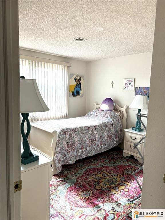 156 Pelham Ln Unit 156N, Monroe, NJ 08831 - bedroom with a textured ceiling and carpet flooring