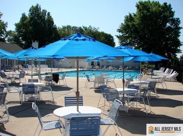 156 Pelham Ln Unit 156N, Monroe, NJ 08831 - community pool featuring a patio area