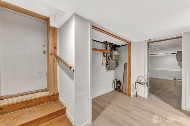 staircase featuring wood-type flooring