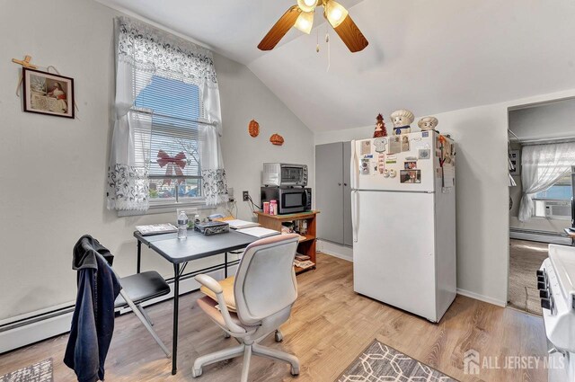 dining room with a wealth of natural light, ceiling fan, light hardwood / wood-style floors, and a baseboard radiator