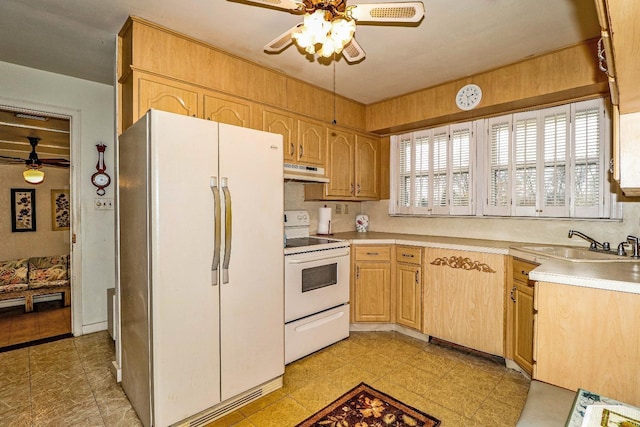 kitchen with sink, white appliances, light brown cabinets, and ceiling fan