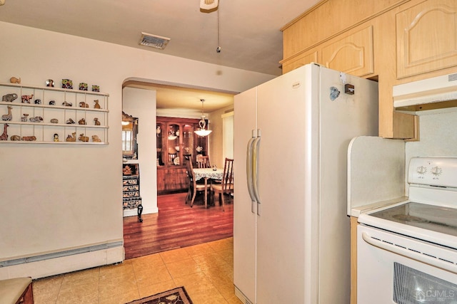 kitchen with hanging light fixtures, light tile patterned flooring, baseboard heating, white appliances, and light brown cabinetry