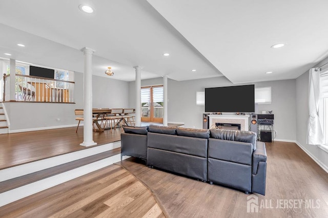 17 Thomas Rd, East Brunswick, NJ 08816 - living room featuring ornate columns, wood finished floors, recessed lighting, and a fireplace