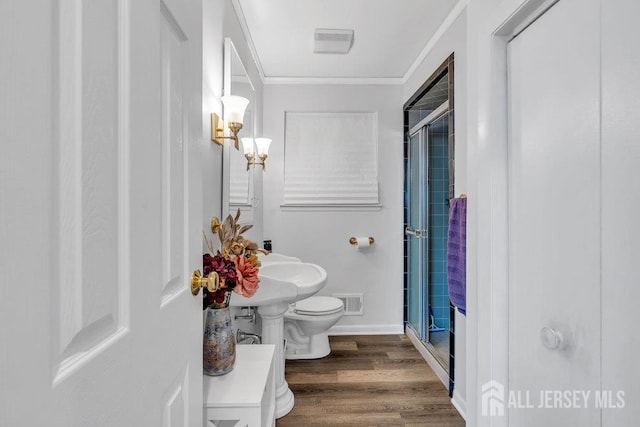 17 Thomas Rd, East Brunswick, NJ 08816 - bathroom with crown molding, a shower stall, and wood finished floors