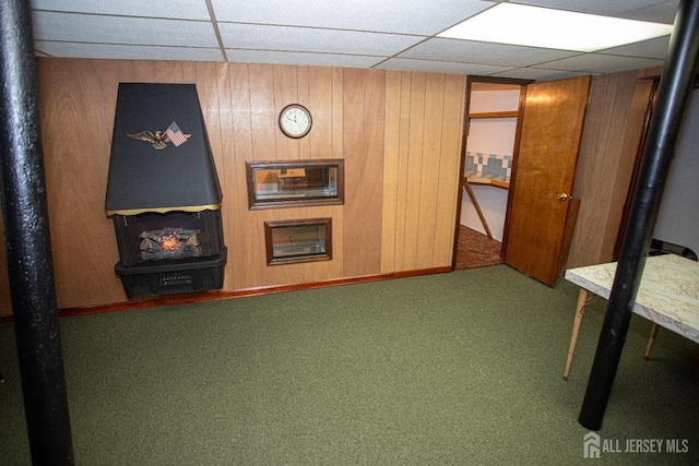 interior space featuring carpet and wooden walls