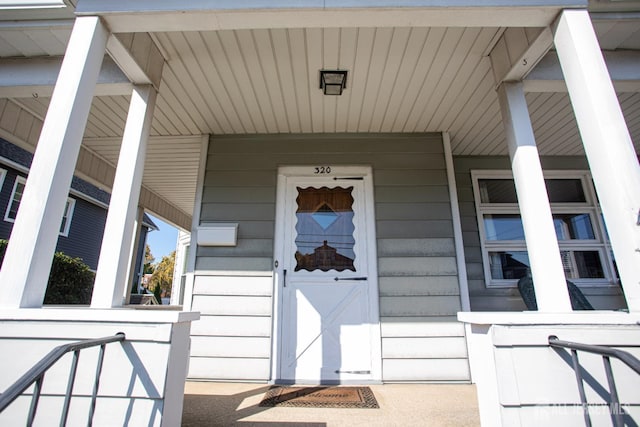 doorway to property featuring a porch