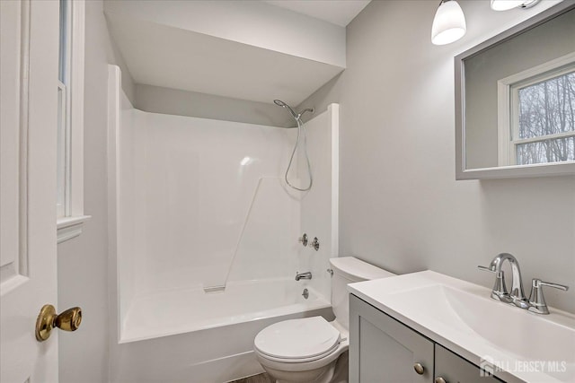 full bath with vanity,  shower combination, and toilet