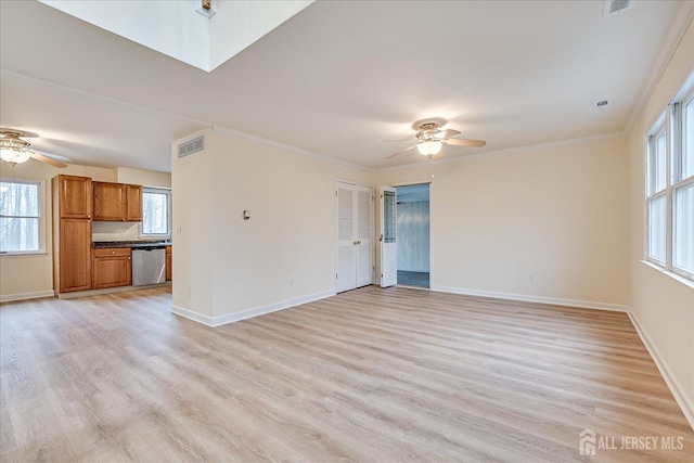 unfurnished living room with visible vents, light wood-style flooring, ornamental molding, baseboards, and ceiling fan