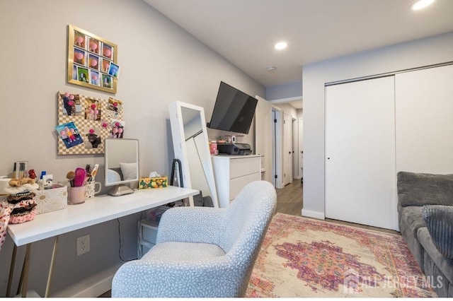 office with light hardwood / wood-style flooring