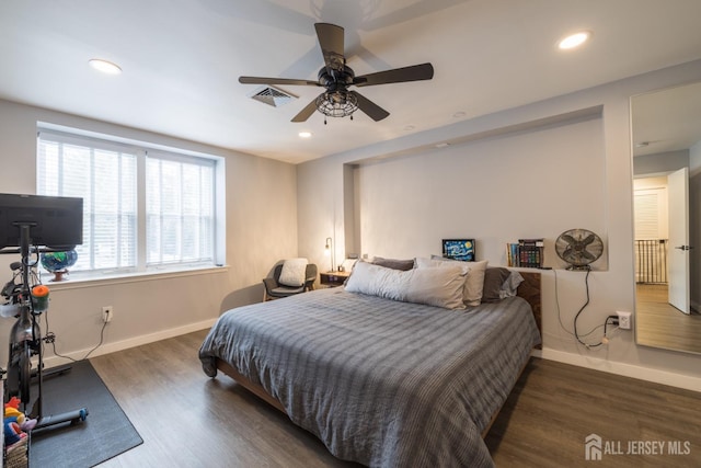 bedroom featuring dark wood-type flooring and ceiling fan