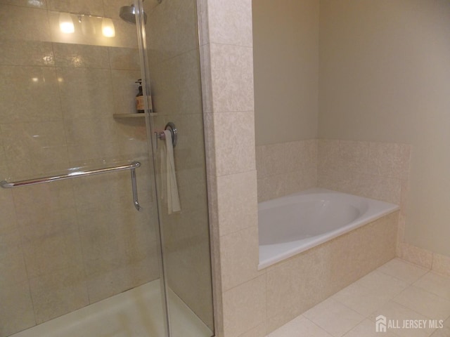 1 Spring St Unit 1205, New Brunswick, NJ 08901 - full bathroom featuring a shower stall, a garden tub, and tile patterned floors