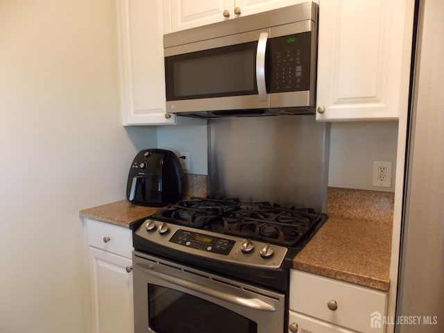 1 Spring St Unit 1205, New Brunswick, NJ 08901 - kitchen featuring stainless steel appliances and white cabinetry