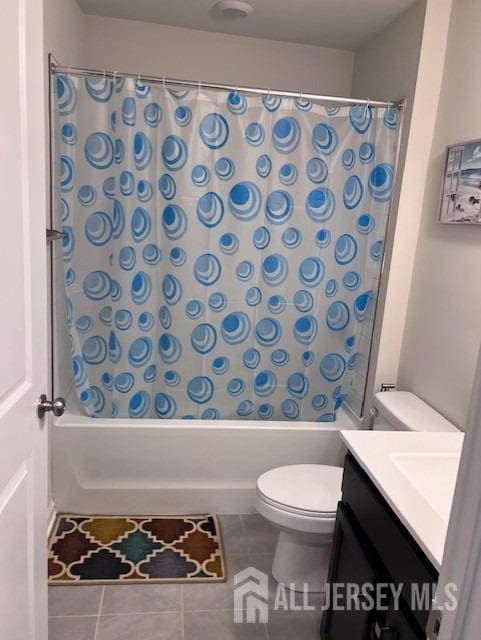 bathroom featuring tile patterned flooring, shower / bathtub combination with curtain, toilet, and vanity