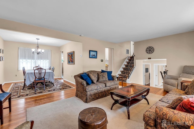 6 Onondaga St, Old Bridge, NJ 08857 - living room with light wood-style flooring, a chandelier, stairs, and baseboards