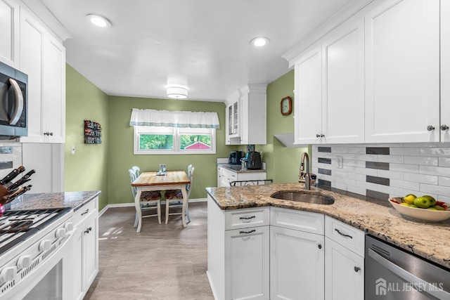 6 Onondaga St, Old Bridge, NJ 08857 - kitchen with a sink, stainless steel appliances, white cabinets, baseboards, and recessed lighting