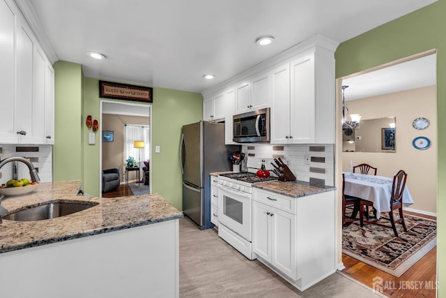 6 Onondaga St, Old Bridge, NJ 08857 - kitchen with stainless steel appliances, a sink, white cabinets, and recessed lighting