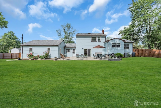 6 Onondaga St, Old Bridge, NJ 08857 - back of property with a patio and a chimney