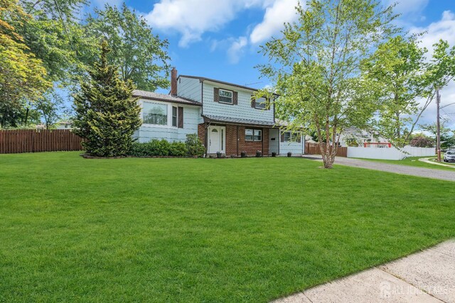 6 Onondaga St, Old Bridge, NJ 08857 - tri-level home with a chimney and brick siding