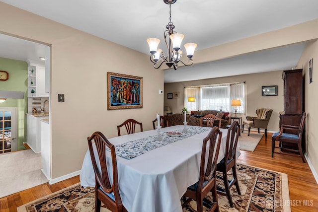 6 Onondaga St, Old Bridge, NJ 08857 - dining room featuring light wood-type flooring, a chandelier, and baseboards