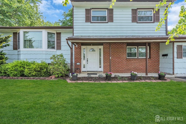 6 Onondaga St, Old Bridge, NJ 08857 - split level home with a front yard and brick siding