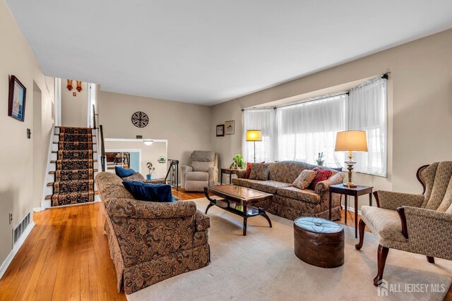 6 Onondaga St, Old Bridge, NJ 08857 - living room with stairway, hardwood / wood-style floors, and baseboards