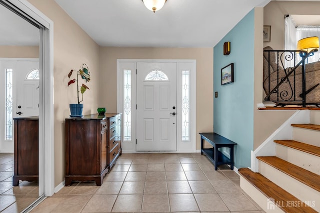 6 Onondaga St, Old Bridge, NJ 08857 - foyer entrance with light tile patterned flooring, stairs, and baseboards