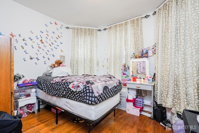 bedroom with wood finished floors