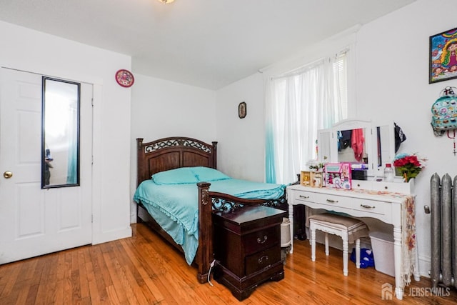 bedroom featuring light wood finished floors