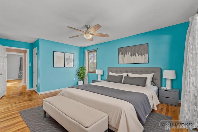 bedroom featuring ceiling fan and wood-type flooring